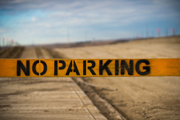 No Parking sign on construction site made of wood