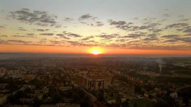 Timelapse sunrise over the city from bird&rsquo;s eye view. Stabilized drone shot, FullHD 1080p.