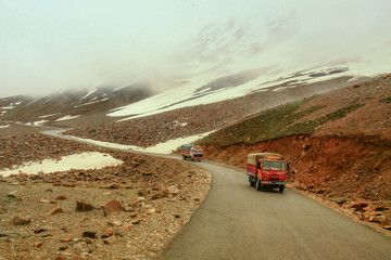 Trucks on a road in the mountains