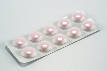 Plate with medical pills packed shot close up