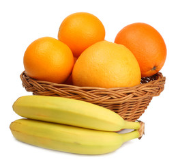 citrus fruits in basket isolated on white