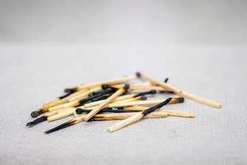 Burned matches on a light background. Used, unnecessary things_
