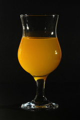 Orange drink in a cocktail glass	