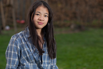 Portrait of a young cute girl looking at the camera