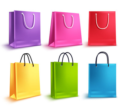 Shopping bags vector set. Colorful empty paper bag collection for store shopping and promotional design elements isolated in white. Vector illustration.