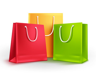 Paper bags group vector illustration. Empty shopping bags with assorted colors isolated in white for fashion and store market design elements.