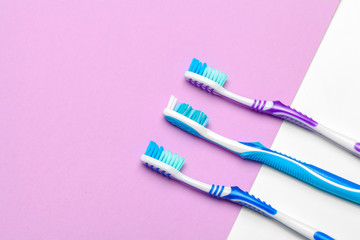 Toothbrushes on pink background