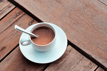 cup of coffee on the wooden table