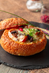 Homemade mushroom cream soup, served in bread bowl
