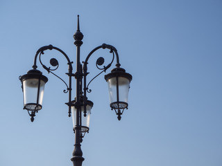Fototapeta na wymiar Street light with three lamps