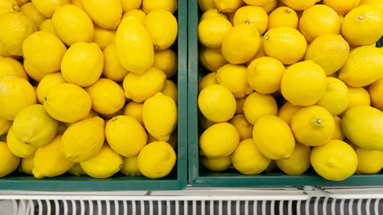 Lemon raw many on the basket in market background and department store. displayed is sale, Vegetables for health. Foods concept..