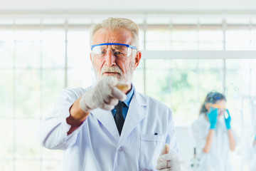 Portrait Science men working with chemicals in lab