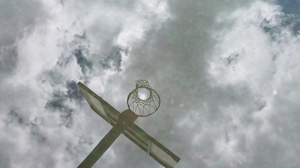 Reflection of basketball rim and board on water during a cloudy day © rand.moment