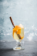 Mulled white wine on the rustic background. Selective focus. Shallow depth of field.