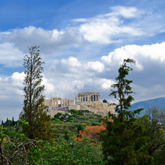 Fototapeta na wymiar Acropolis of Athens Greece under a blue cloudy sky, view from Pnyx hill