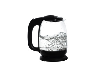 Glass teapot with boiling water, close-up on a white background