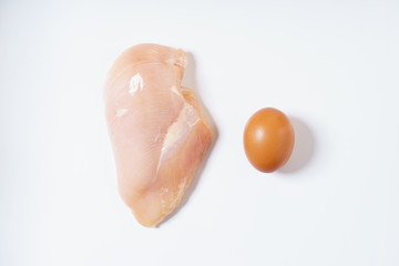 raw chicken meat and egg