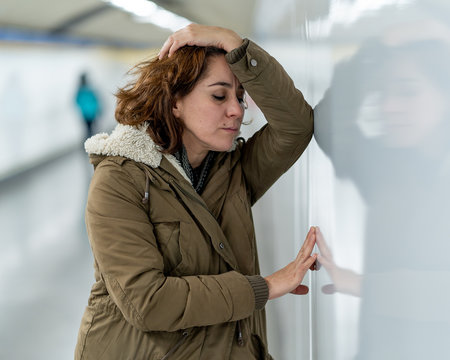 Unhappy young woman feeling sad and stressed suffering from depr