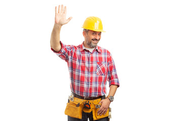 Constructor holding palm up as greeting concept.