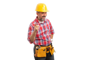 Constructor holding finger as joking concept.
