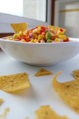 Mexican salsa dip with nachos chips. Vegetarian food.