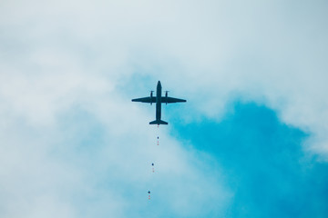 Military parachutist on the background. Rangers parachuted from airplanes.