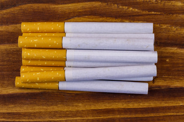 Tobacco cigarettes on wooden table