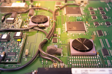 Closeup Electronic circuit board with wire signaling and light on background