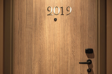 Happy New Year 2019 concept, lettering on the Hotel door