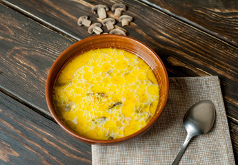 soup with mushrooms on a wooden table