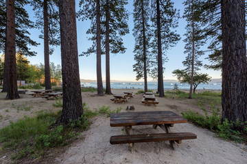 Beautiful view of Lake Tahoe beach with picnic area and pine trees, California