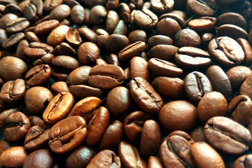 Roasted brown coffee beans texture background. Сlose up pattern photography