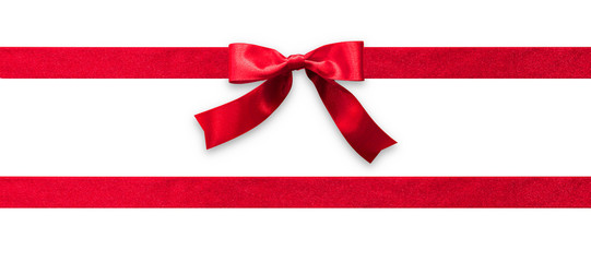 Red ribbon band stripe or satin fabric bow isolated on white background with clipping path for banner design, greeting card and Christmas gift decoration - obrazy, fototapety, plakaty
