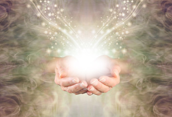 Sending You High Resonance Healing Energy - female cupped hands emerging from a green gold swirling...
