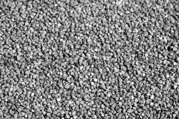 Pile of buckwheat close-up in black and white.