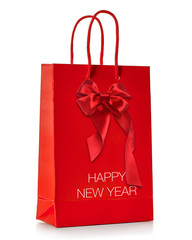 Happy new year written on gift or red shopping bag isolated on white background 
