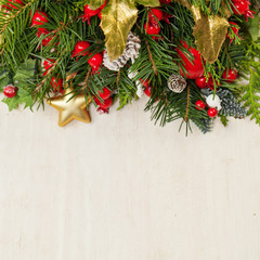 Fototapeta na wymiar Christmas background with green Xmas tree twig and New Year decoration