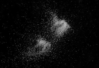 Crystal salt isolated on black background, top view