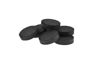 activated carbon pills isolated on white background