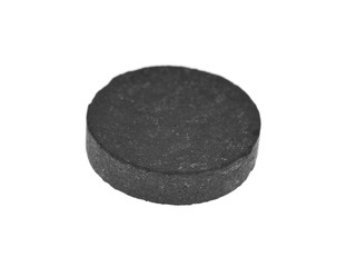 activated carbon pills isolated on white background