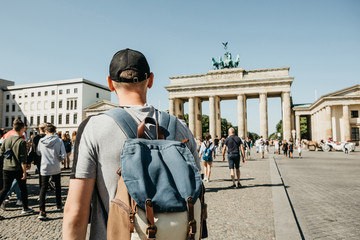 Tourist with backpack visiting Brandenburg Gate in Berlin, Germany © franz12