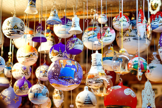 Colorful close up details of christmas fair market. Balls decorations for sales. Xmas market in Germany with traditional decorative toys.