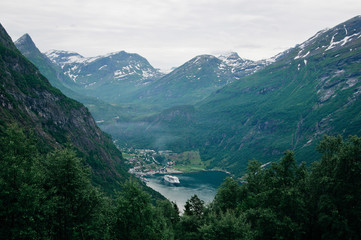 Fototapeta na wymiar The Geiranger Fjord. One of the most popular among tourists fjord. Very picturesque and beautiful place. Travel to Norway