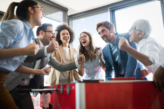 Excited Diverse Employees Enjoying Funny Activity At Work Break, Creative Friendly Workers Play Game