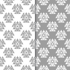 White and gray floral backgrounds. Set of seamless patterns