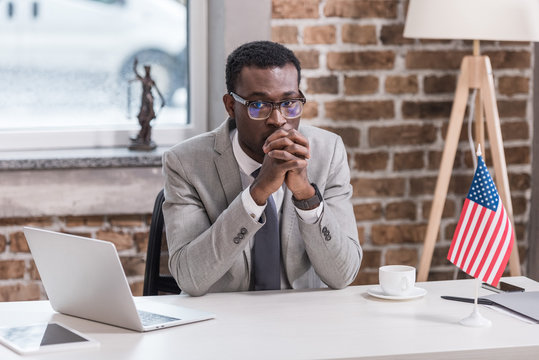 African American Businessman Sitting At Desk Modern Office