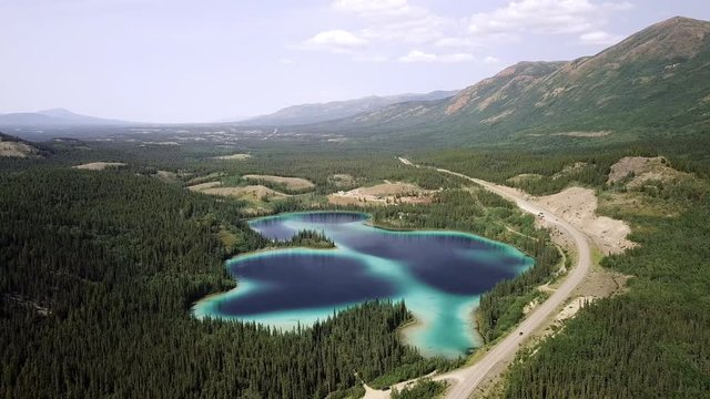 Aerial Backward Slow: Small Lake in Vast Area