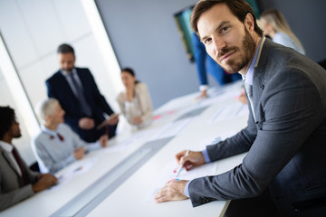 Business colleagues working in modern conference room