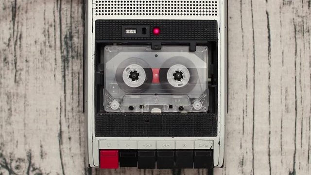 Old audio cassette reel playing in the tape recorder