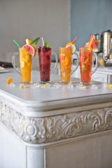 Four fruit cocktails on a vintage table. Healthy healthy drinks. Freshness and aroma. Place for text